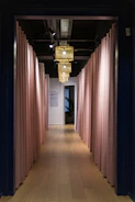 A neat, welcoming hallway with pink decorative elements symbolizing new beginnings.