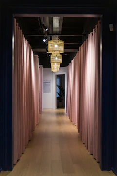 A neat, welcoming hallway with pink decorative elements symbolizing new beginnings.