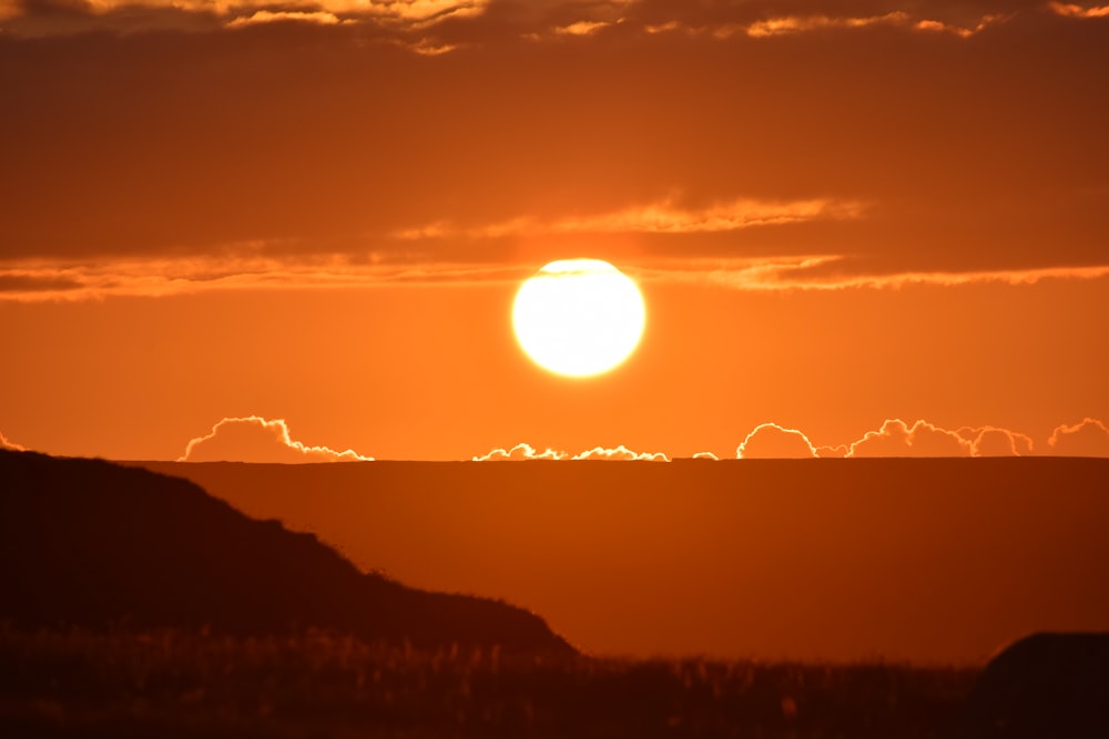 silhouette of mountains during sunset