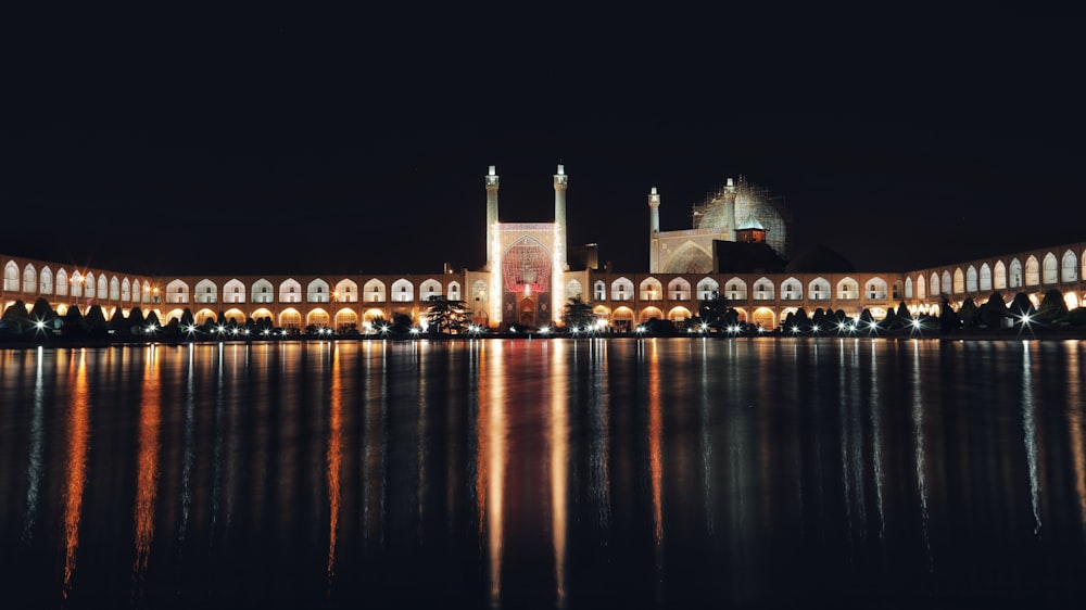 a large building sitting next to a body of water