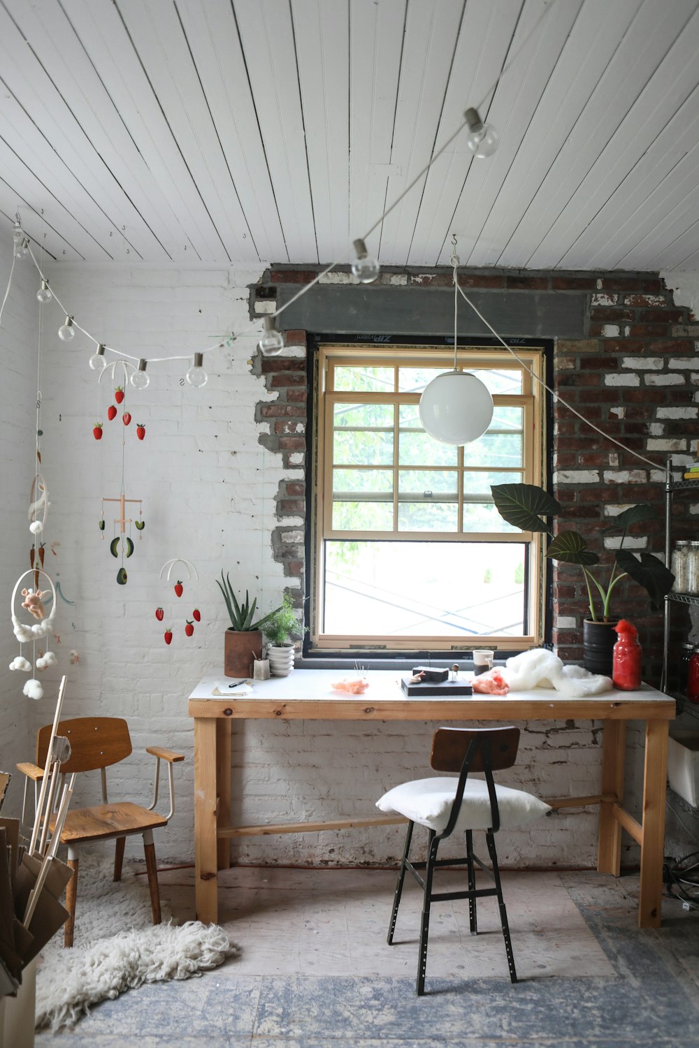 brown wooden table near window