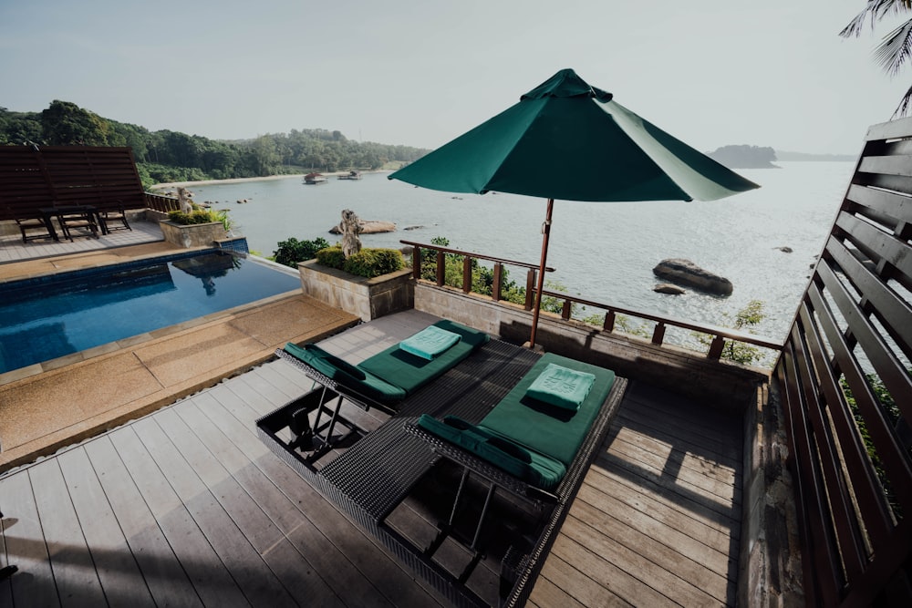 green umbrella on brown wooden table