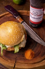 burger with lettuce and fries on brown wooden table