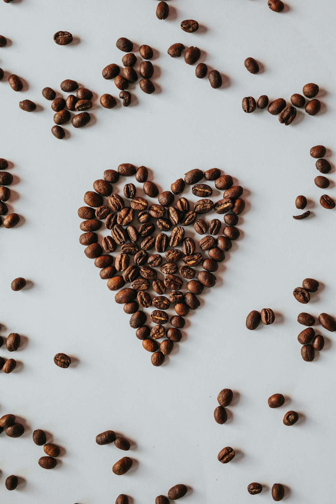 brown coffee beans on white table