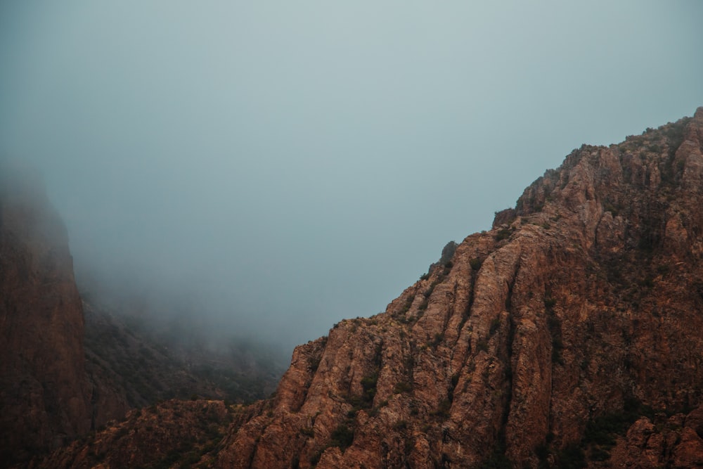 brown rocky mountain under white sky during daytime