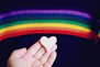 person holding white heart shaped ornament