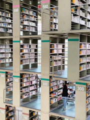 white wooden book shelves with books