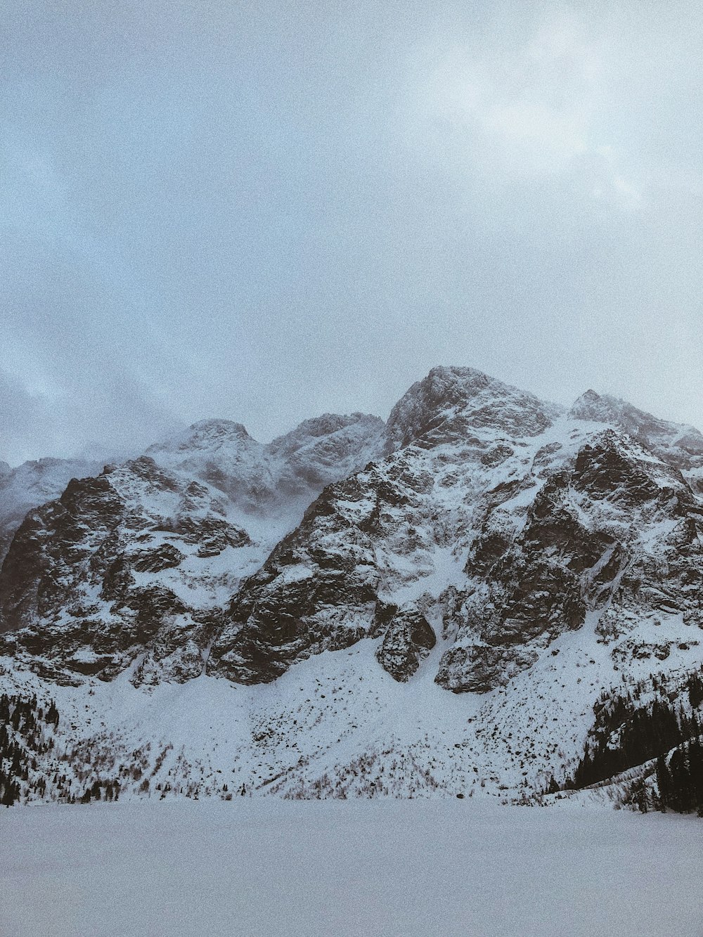 snow covered mountain under blue sky during daytime