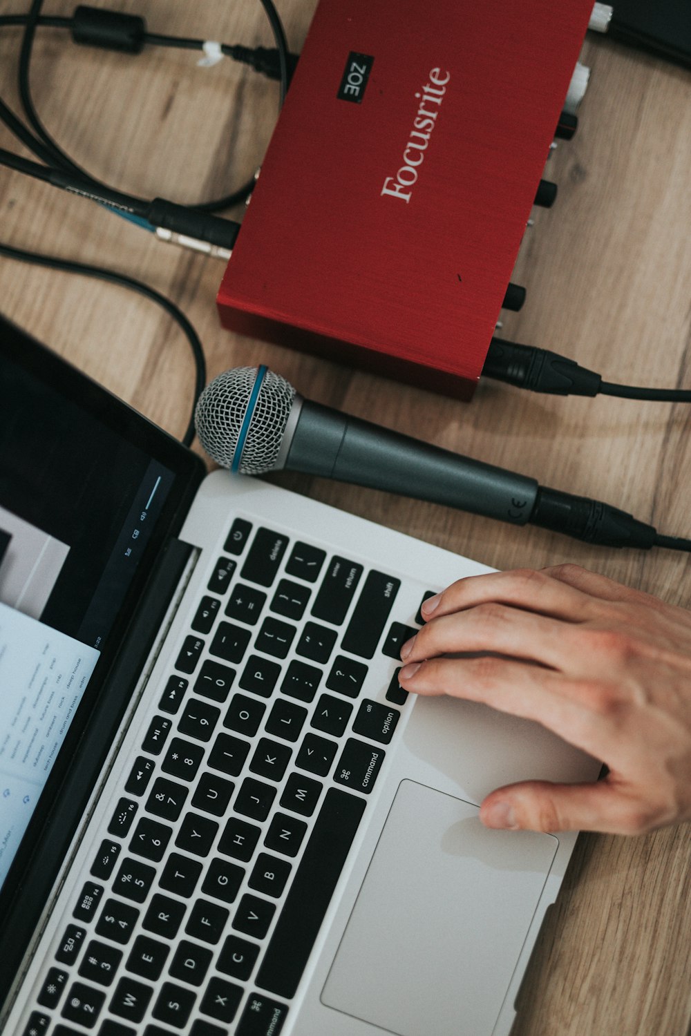 person using red laptop computer