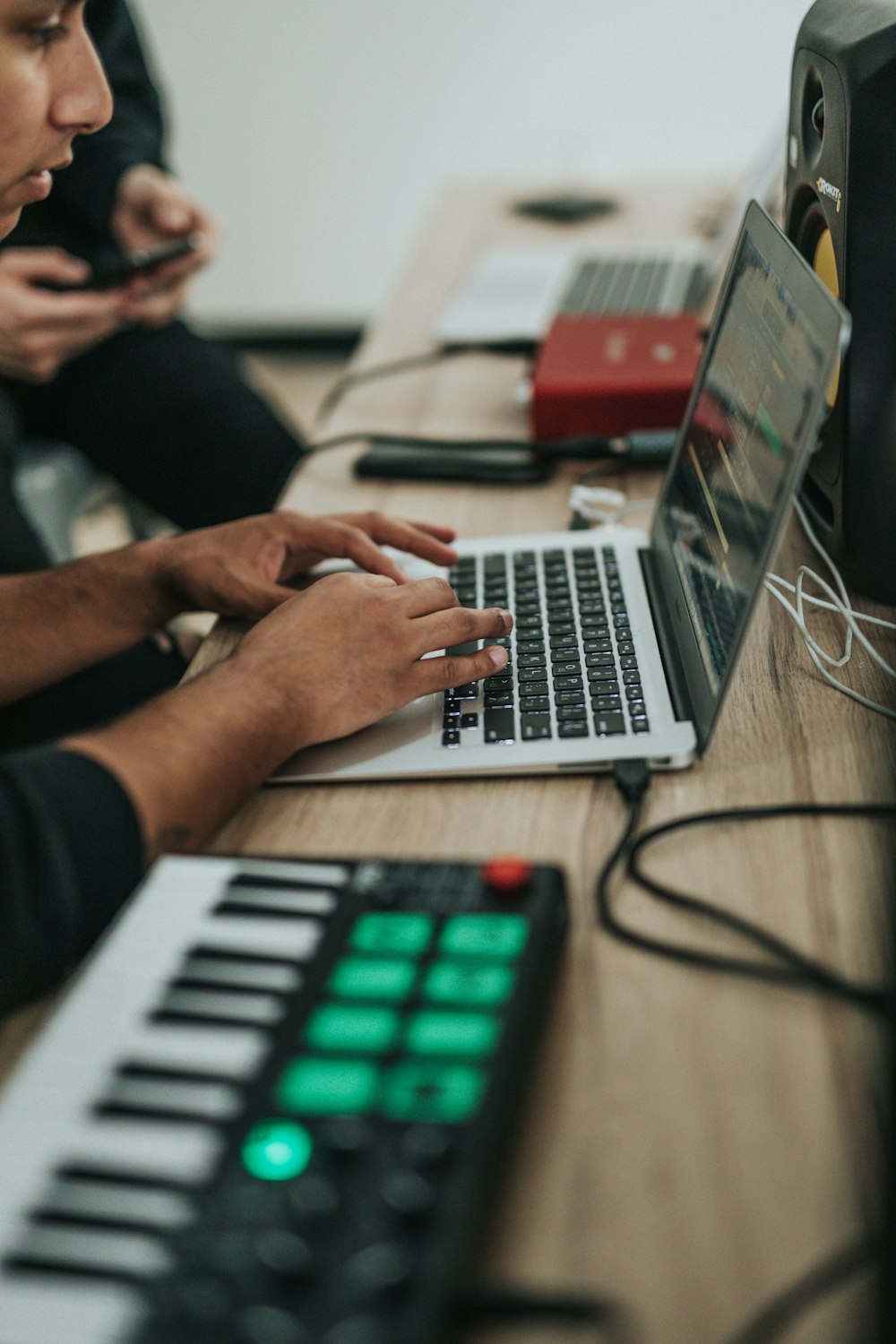 person using macbook pro on table