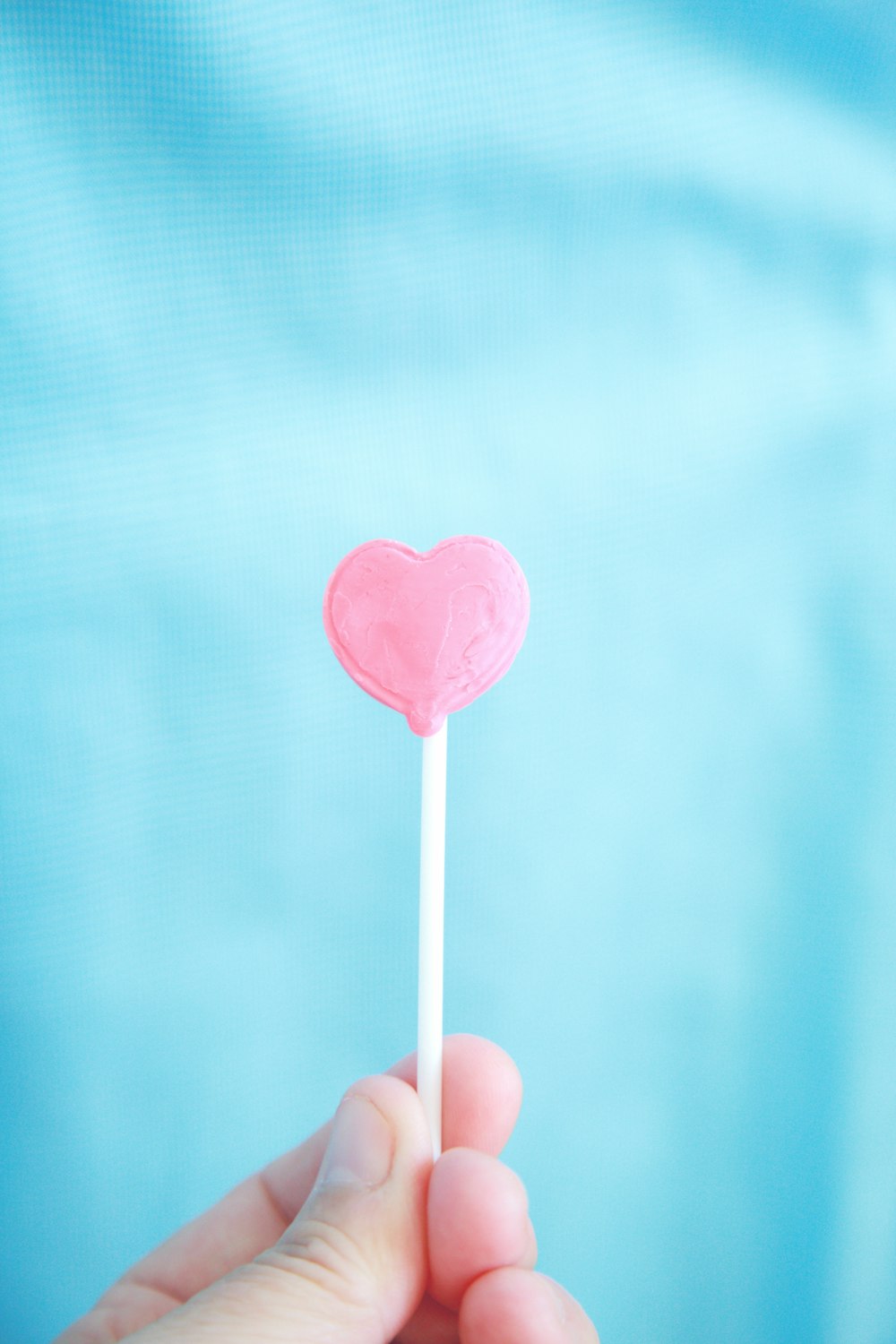 pink lollipop with white background