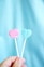pink heart lollipop on white textile