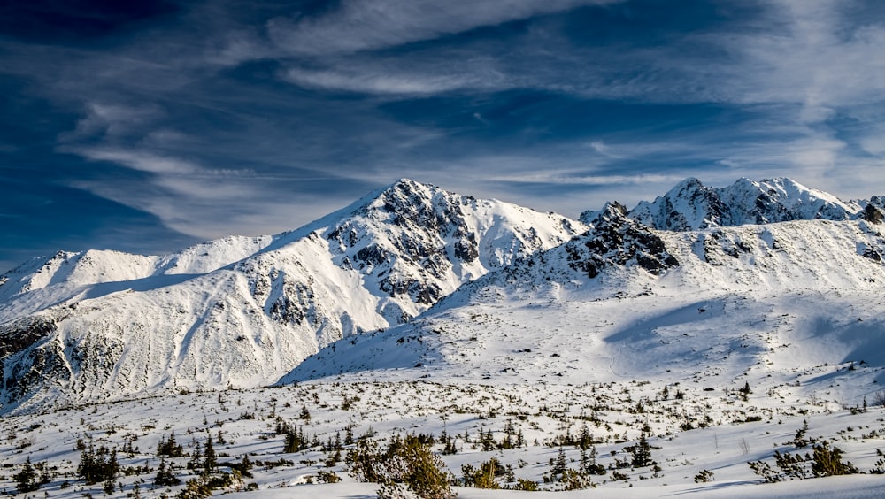 snow covered mountain under blue sky during daytime