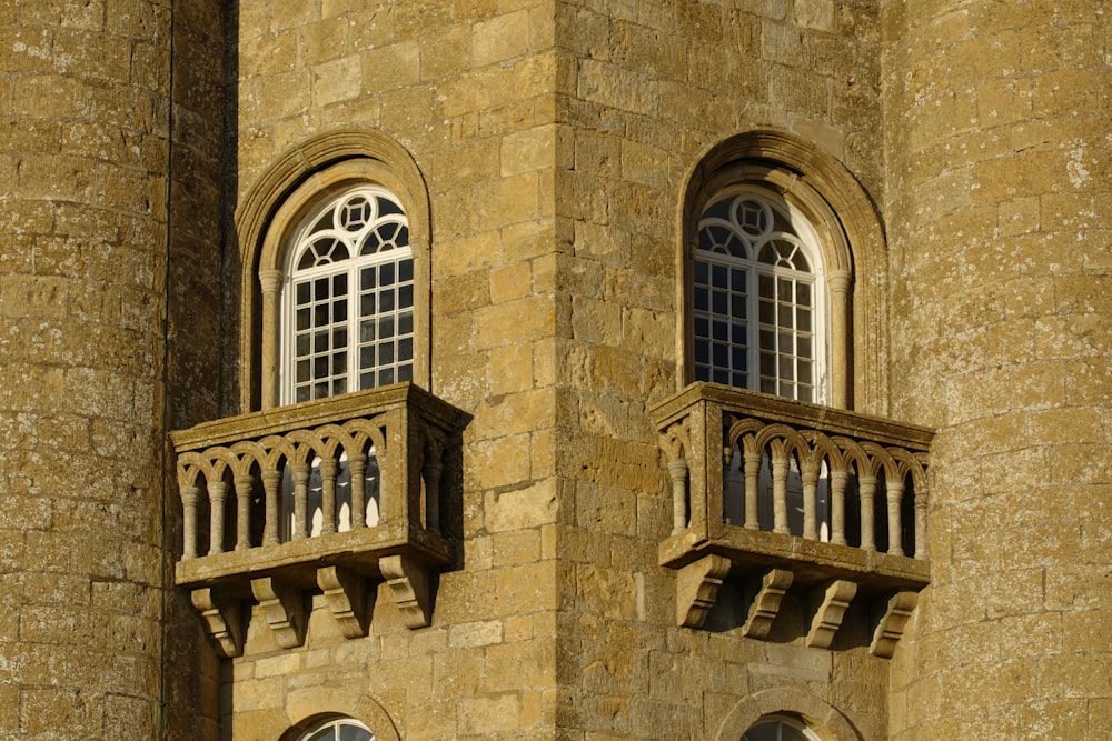 brown concrete building with white window