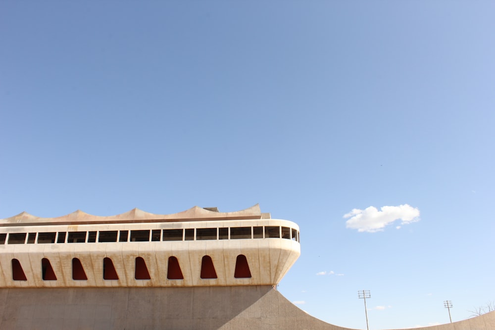 white and brown concrete building under blue sky during daytime