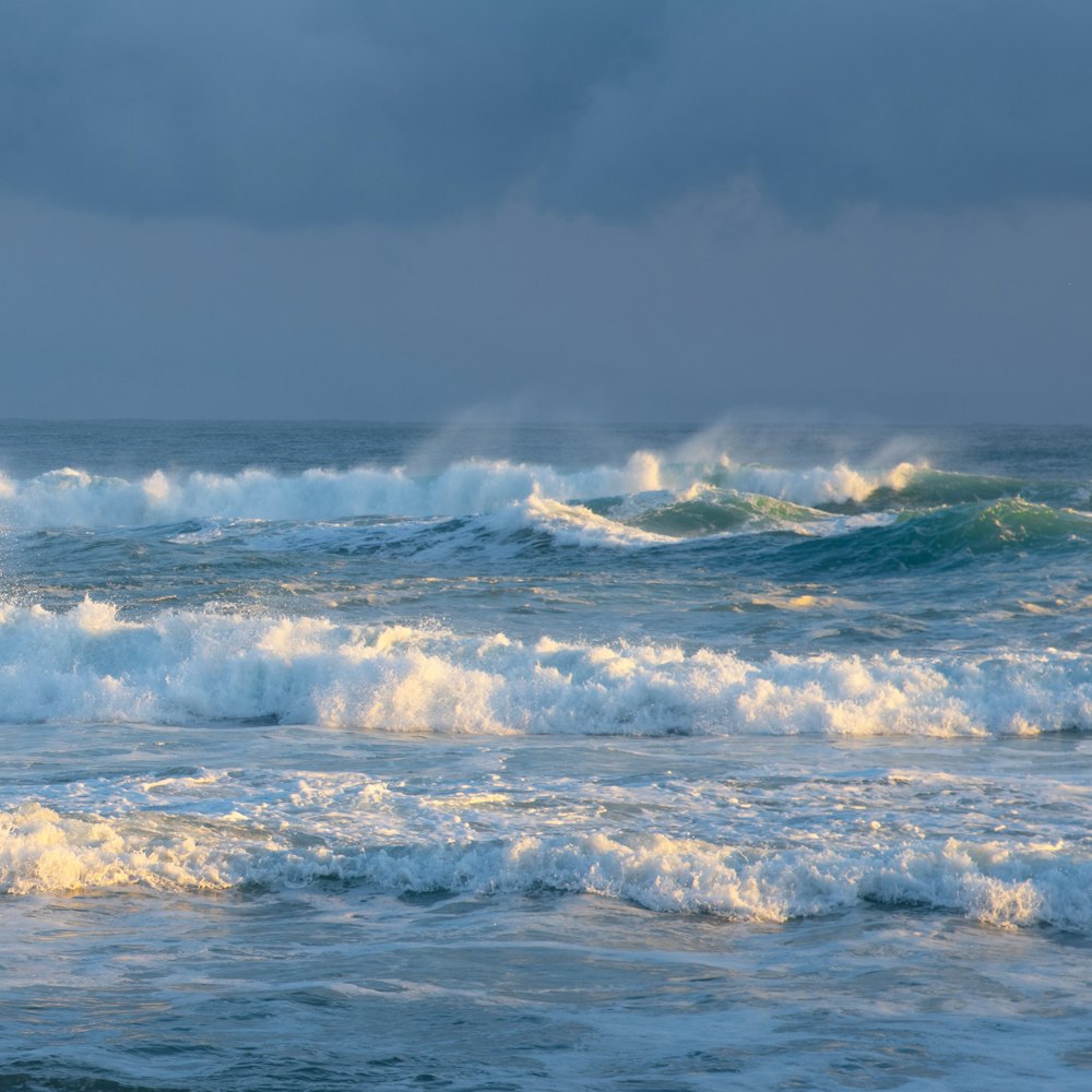 ocean waves under gray sky