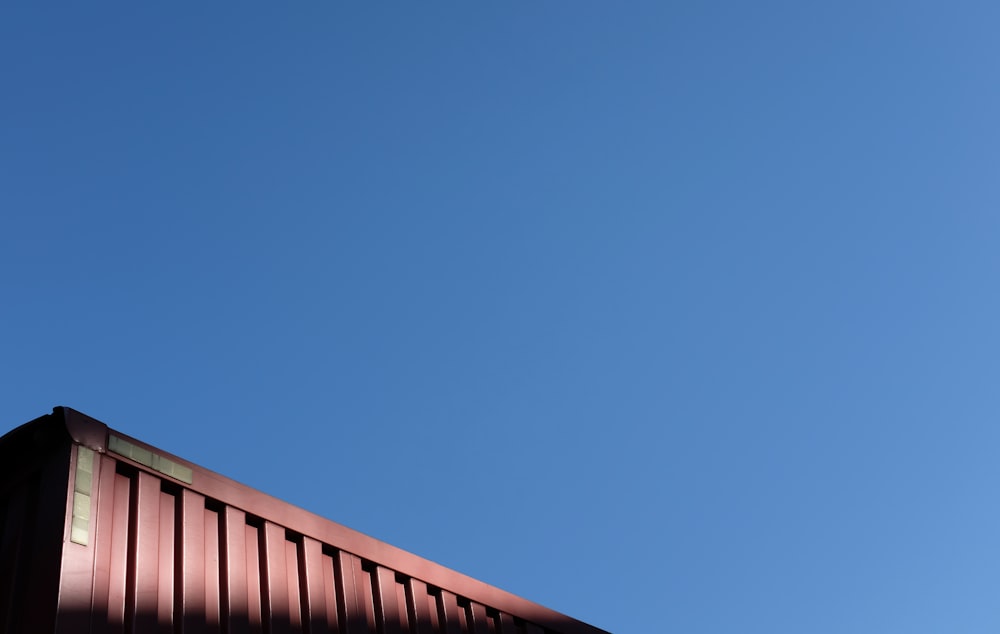 brown wooden fence under blue sky during daytime