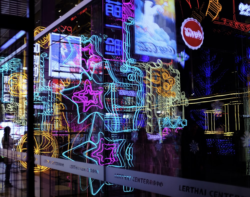 blue red and yellow neon light signage