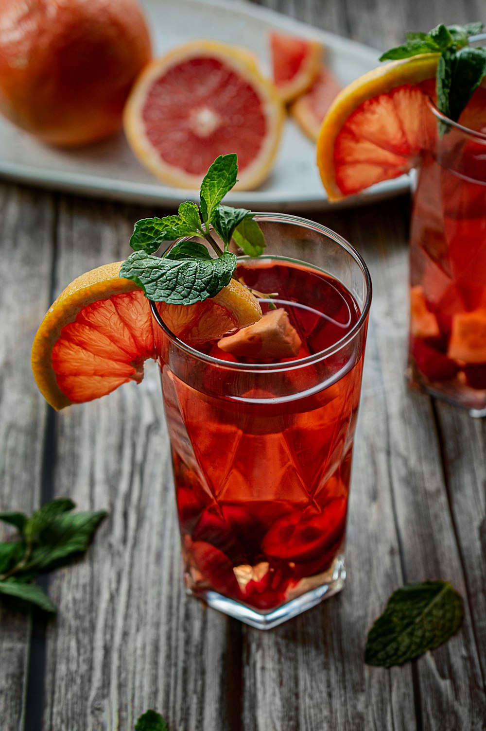 orange juice in clear drinking glass