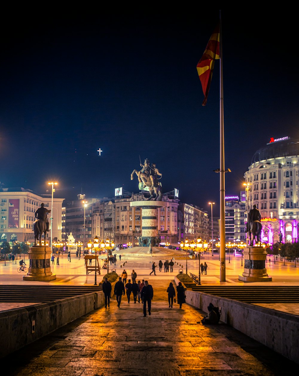 people walking on street during nighttime