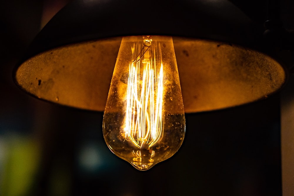 yellow light bulb turned on in close up photography