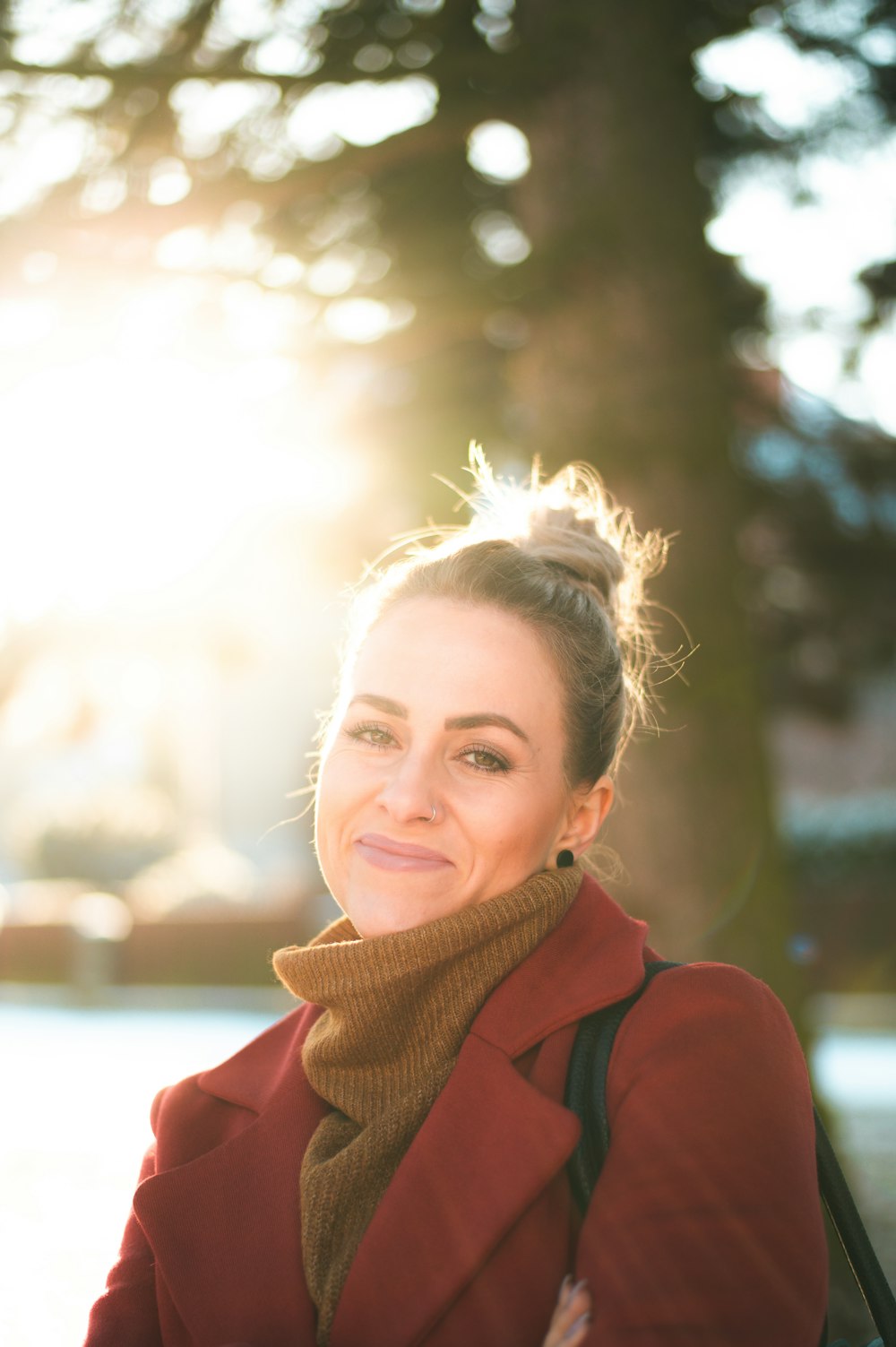 woman in red coat smiling