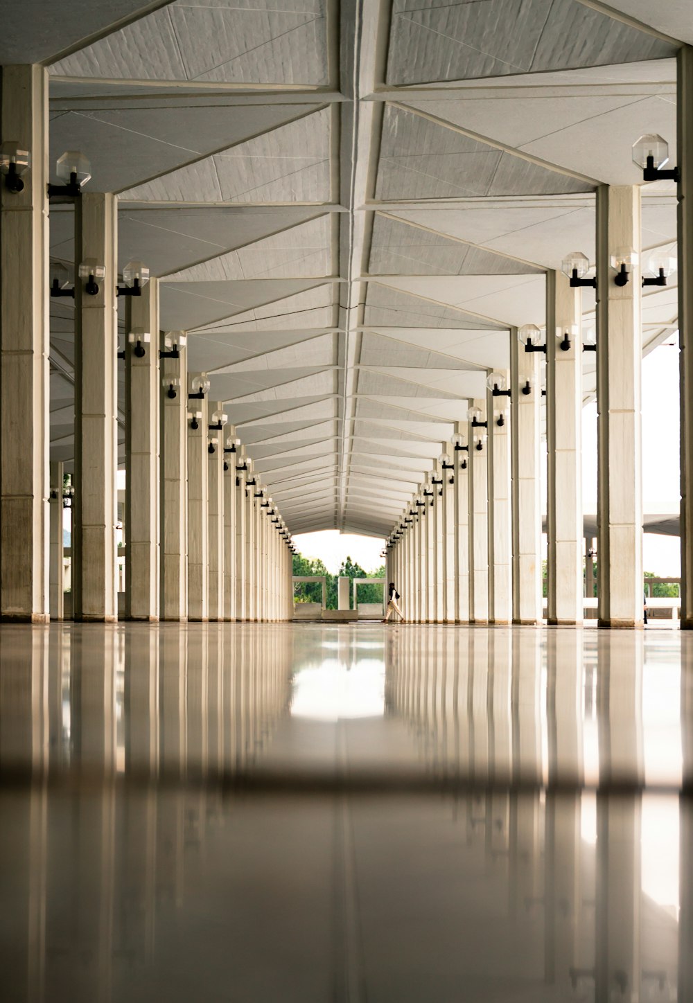 person walking on hallway during daytime