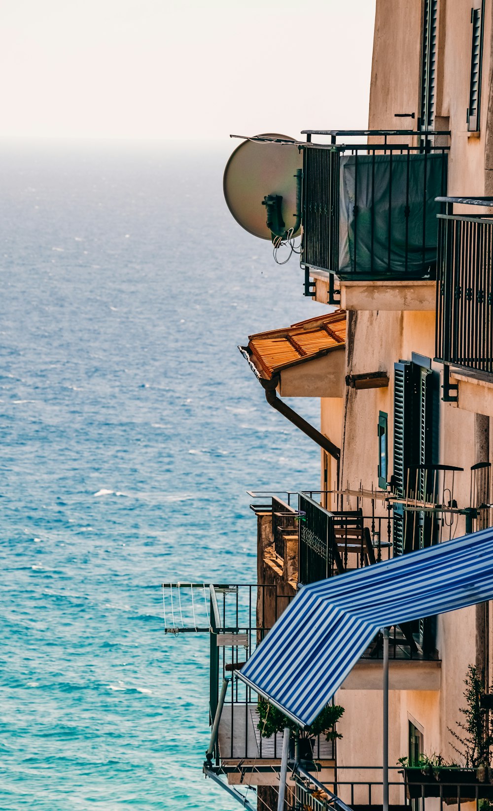 blue and brown wooden houses near sea during daytime