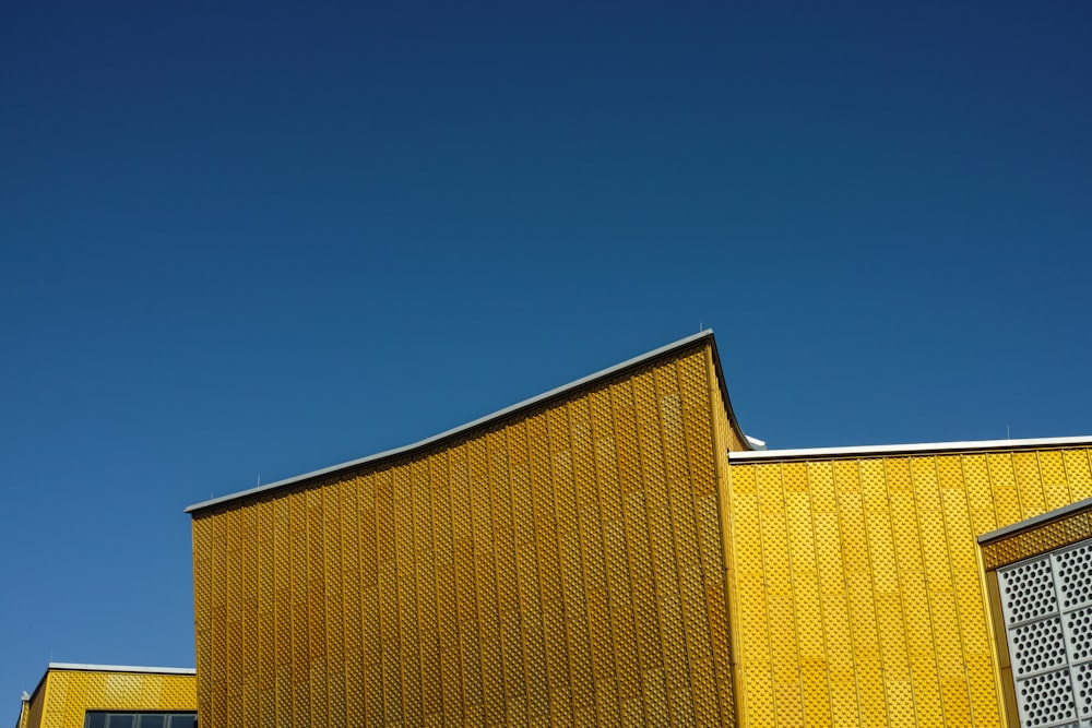 yellow and brown building under blue sky during daytime