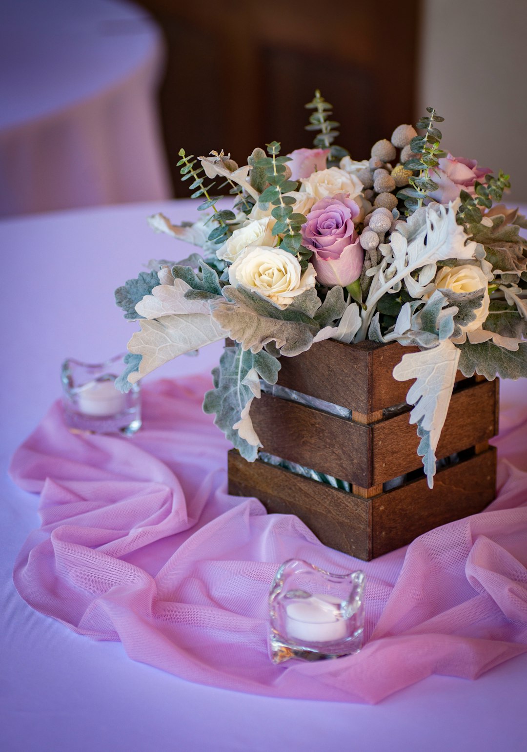 pink and white roses in brown and blue box