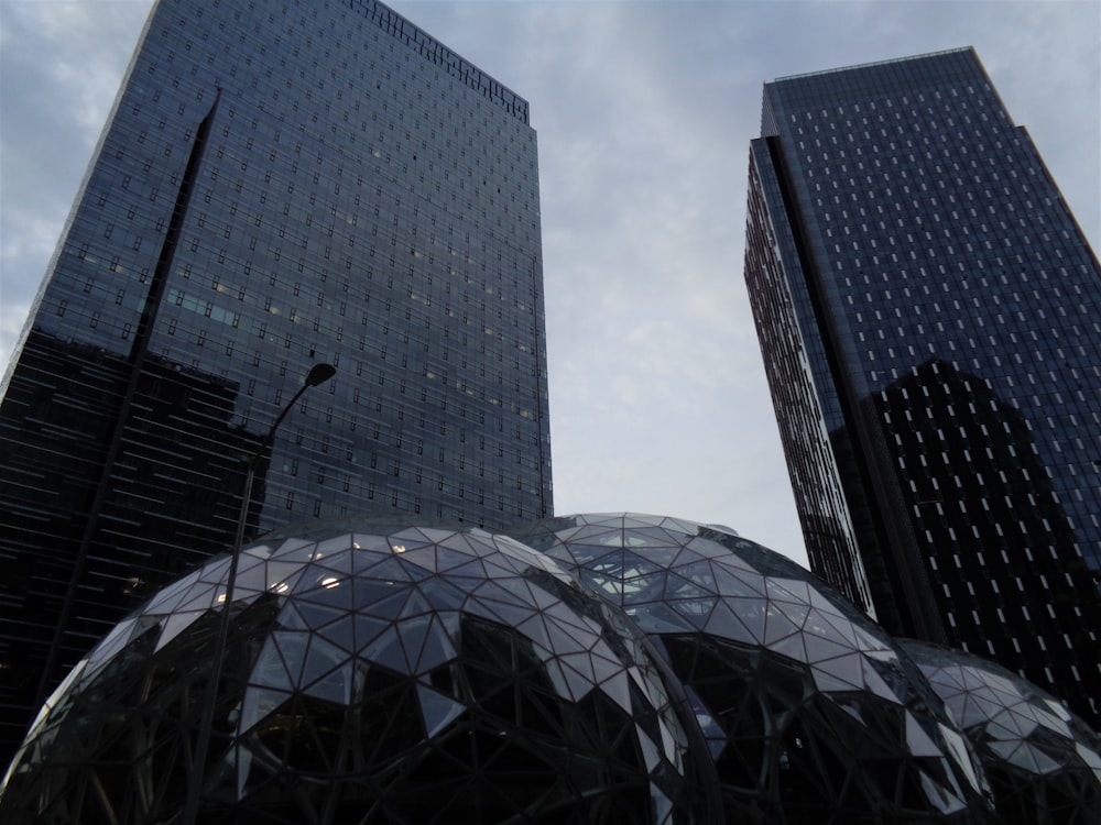 gray concrete building under white clouds during daytime