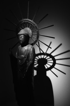 A contemplative digital artwork featuring a serene figure surrounded by radiant light.