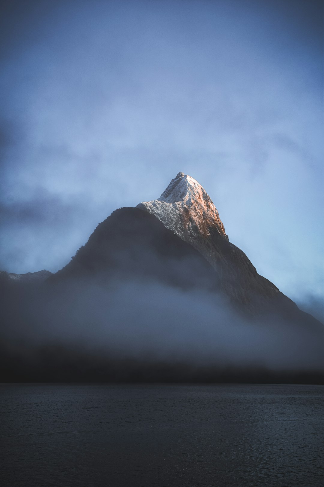  white and black mountain under white clouds ice box