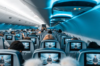 people in airplane during daytime