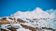 snow covered mountain under blue sky during daytime