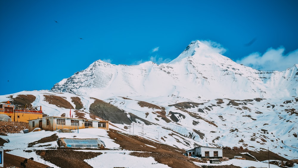 snow covered mountain under blue sky during daytime