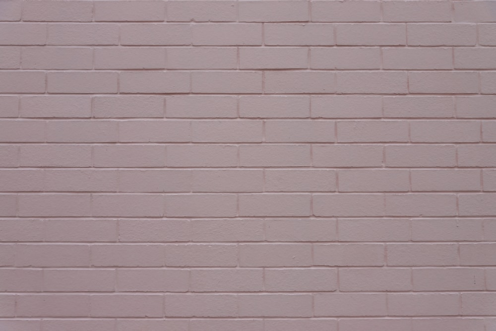white brick wall during daytime