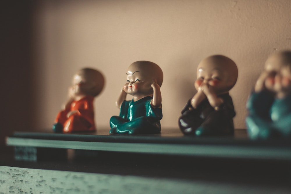 man and woman figurine on black table