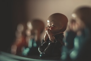 The monk sharing a meal with local villagers, laughter filling the air.