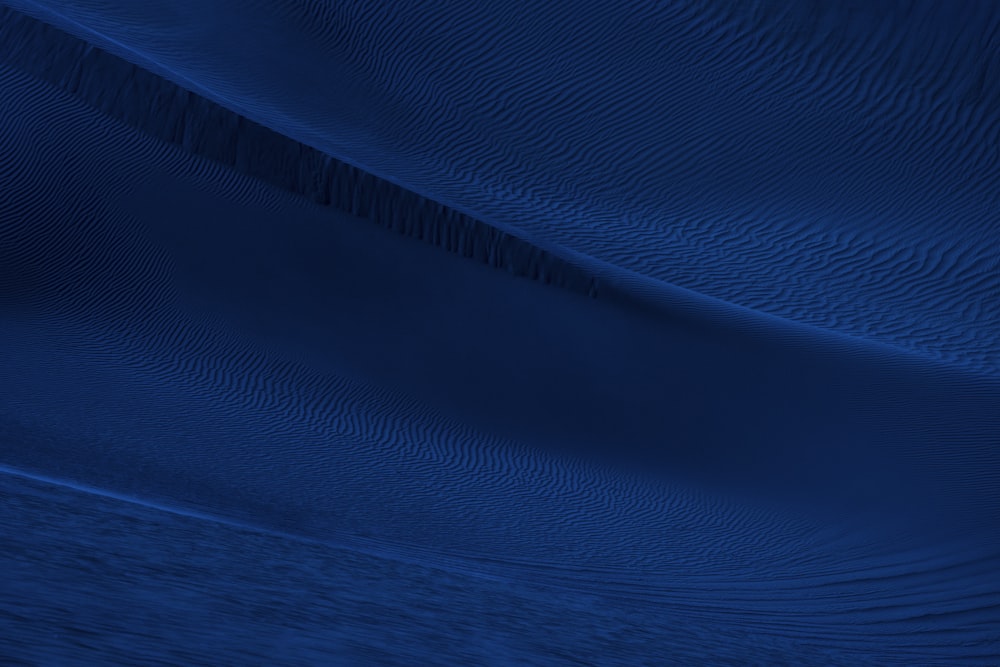 blue textile on brown wooden table