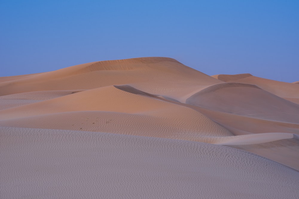 brown desert under blue sky during daytime