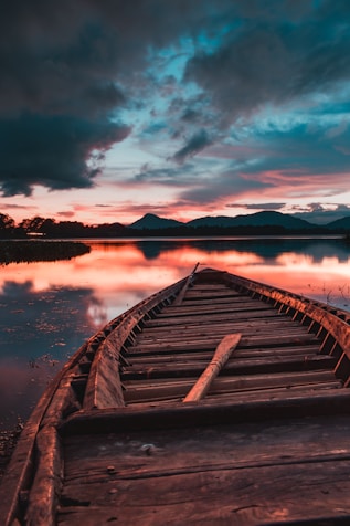 brown wooden dock on lake during daytime