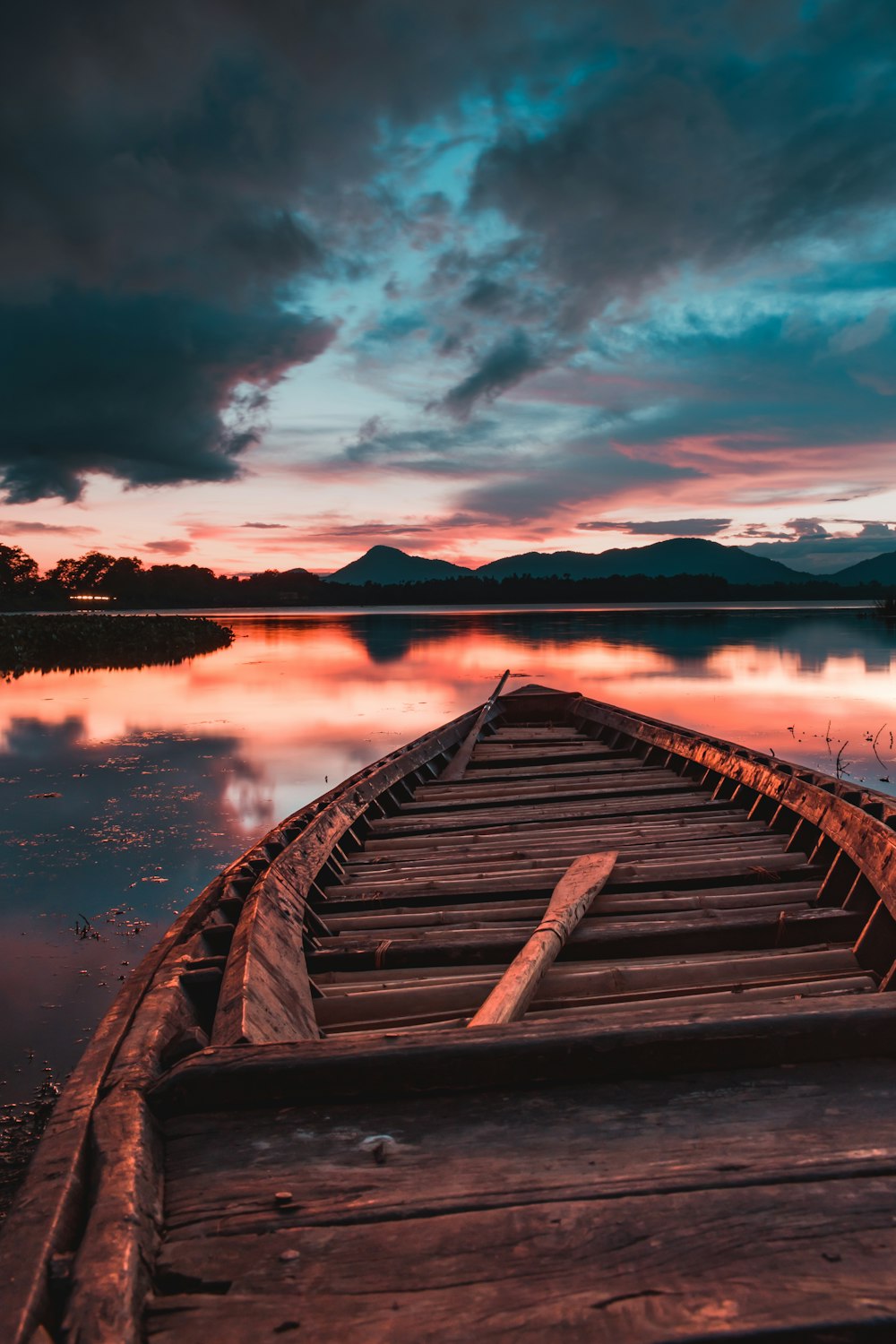 brown wooden dock on lake during daytime