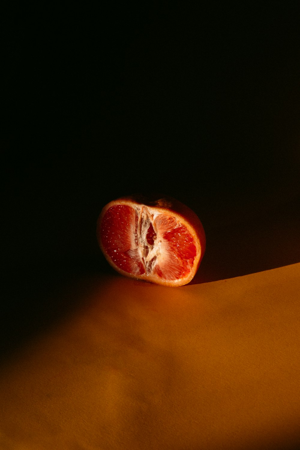 red apple fruit on yellow textile