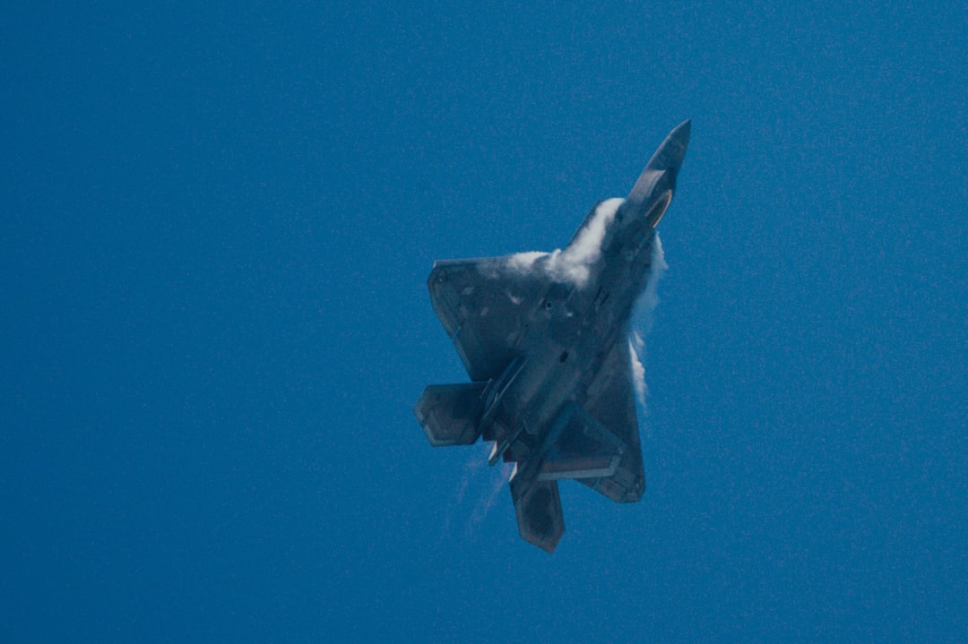 black jet plane in mid air