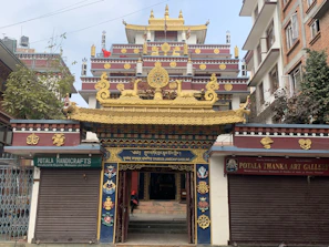 Welcoming entrance of Neeladri Bhakta Niwas with colorful local artwork