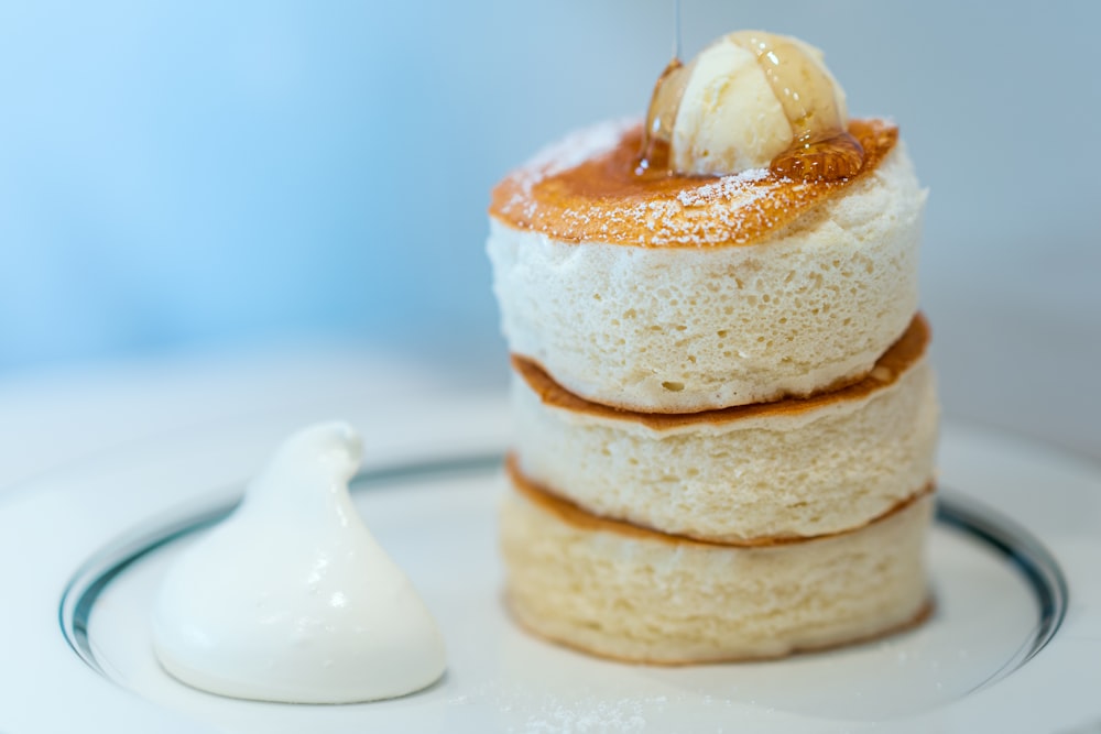 brown and white pastry with white cream on top