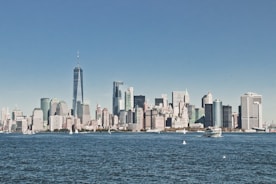 city skyline across body of water during daytime