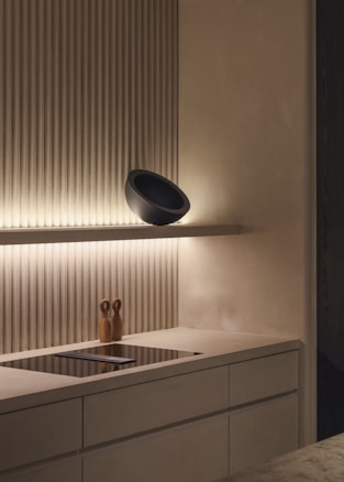 white ceramic sink beside window