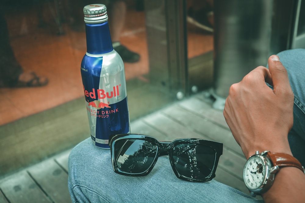 black framed sunglasses on blue denim jeans